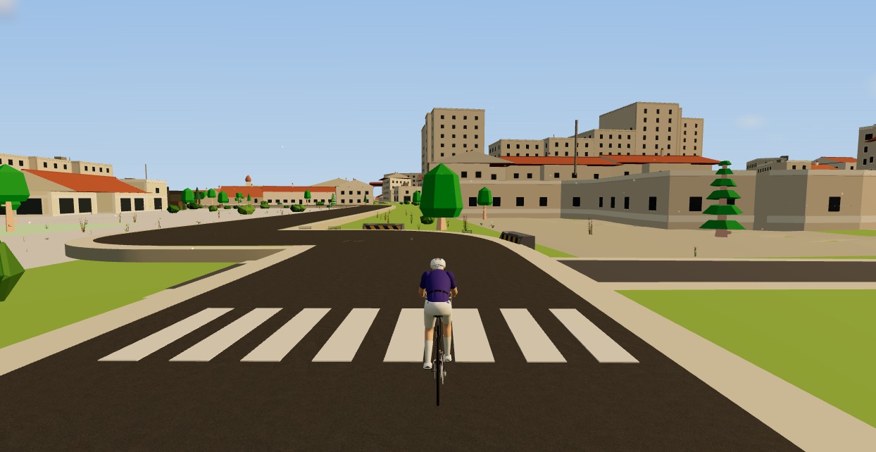 Riding real Ljubljana streets in Moveee Indoor — the buildings, roads and terrain built from map data, with the rider on the bike.